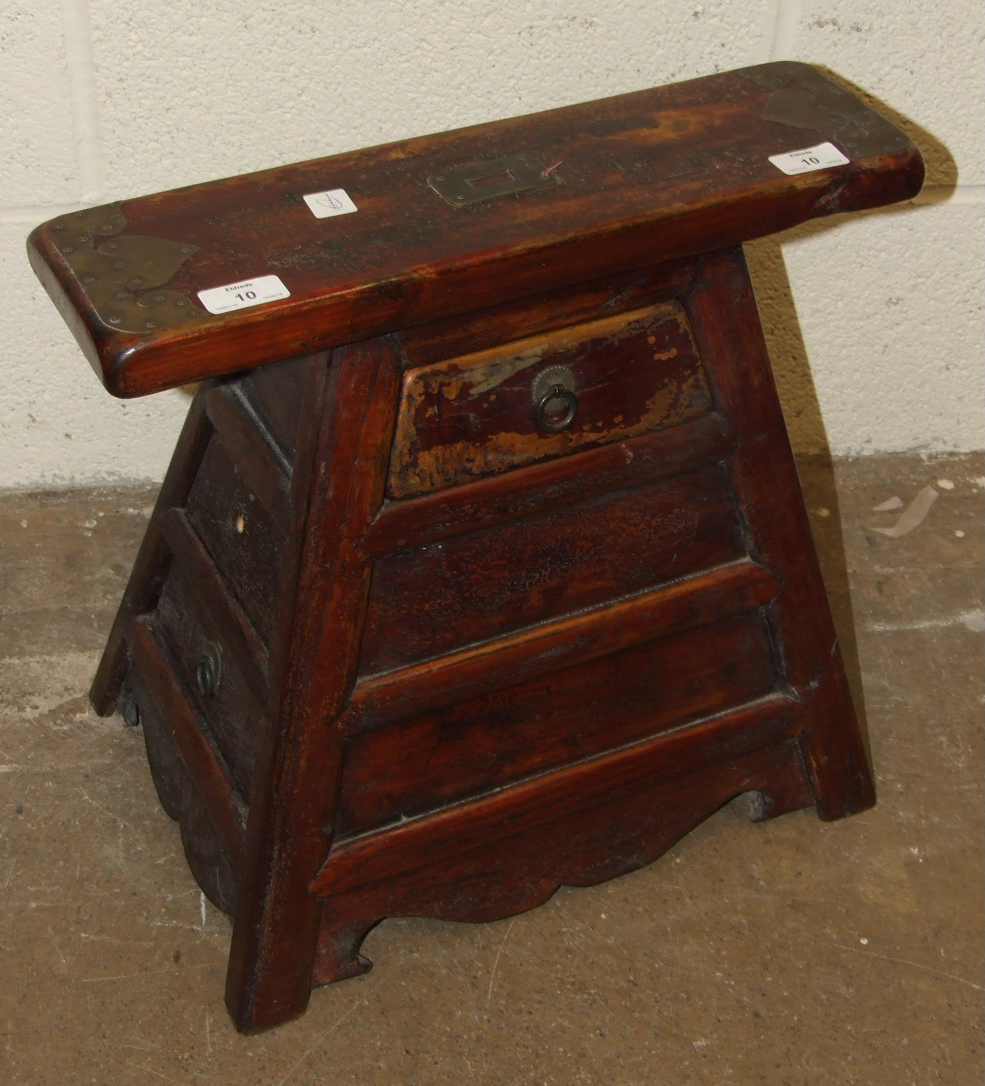 A 20th century lacquered wood shoe trestle of pyramid form with brass mounts, and side and front