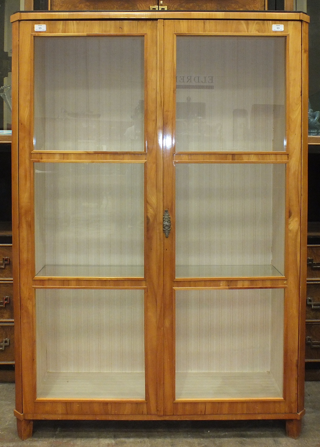 A Continental satinwood display cabinet, the rectangular top above a pair of glazed doors, 102cm - Image 2 of 3