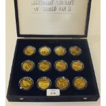 A set of twenty-four brass Marshall Islands Legendary Aircraft of World War II 10-Dollar coins, in