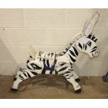 A large Zebra sit-on toy, possibly from a roundabout, of painted wood construction over cast iron