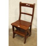 A reproduction hardwood metamorphic library chair.