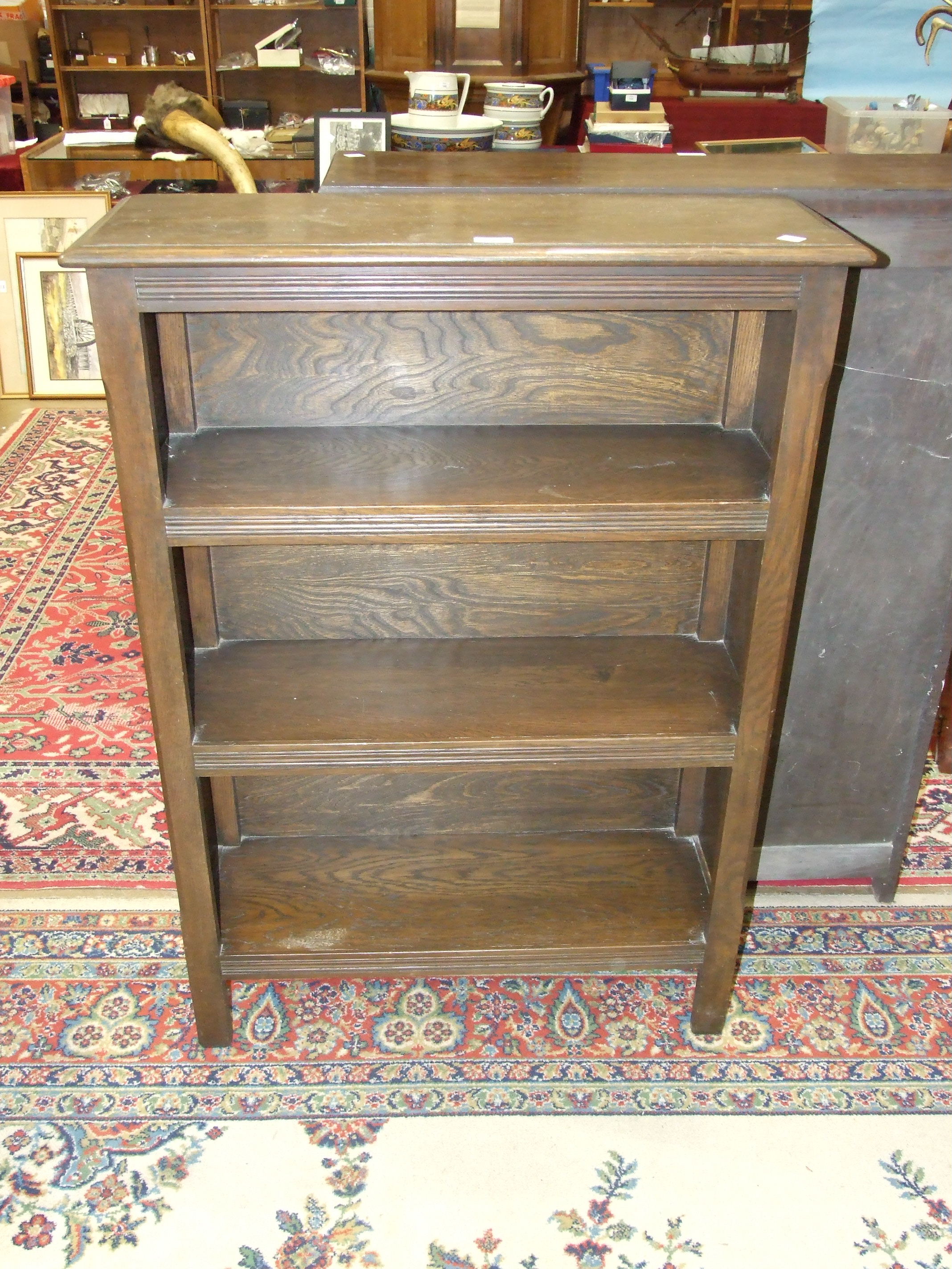 An oak freestanding open bookcase, 91cm wide, 114.5cm high and another smaller similar bookcase, - Image 2 of 2