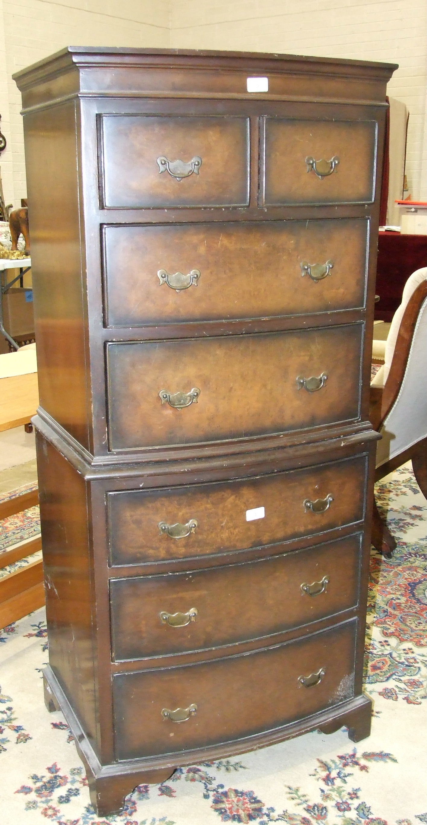 A reproduction walnut small chest of two short and five long drawers, on stand, 143cm high, 62cm