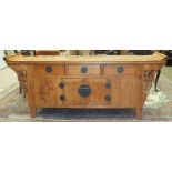 A Chinese-style stained wood sideboard, the rectangular top above three drawers and two cupboard