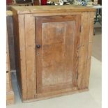 A stripped pine single-door cupboard, 79cm wide, 95cm high and a smaller oak single-door cupboard,