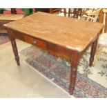 A pine kitchen table with frieze drawer, on turned legs, 122cm wide.