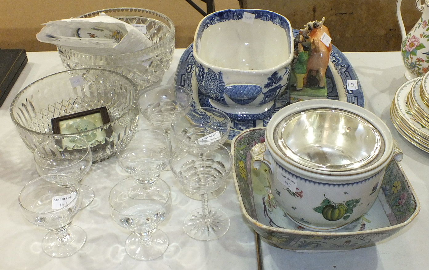 Two large cut glass bowls, a willow pattern ceramic carving dish, a Masons Patent Ironstone