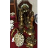 A brass door knocker in the form of a lion's mask, 22cm, a pair of brass candlesticks, three