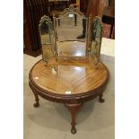 An oak chest of six drawers, 77cm wide, 116cm high, a walnut circular coffee table on cabriole legs,