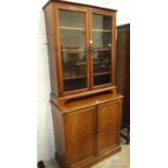 A mahogany glazed floor-standing bookcase on bracket feet, 86cm wide, 107cm high and a mahogany