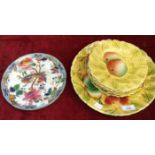 A Sarreguemines majolica plate with raised fruit decoration, 30cm diameter, six matching side