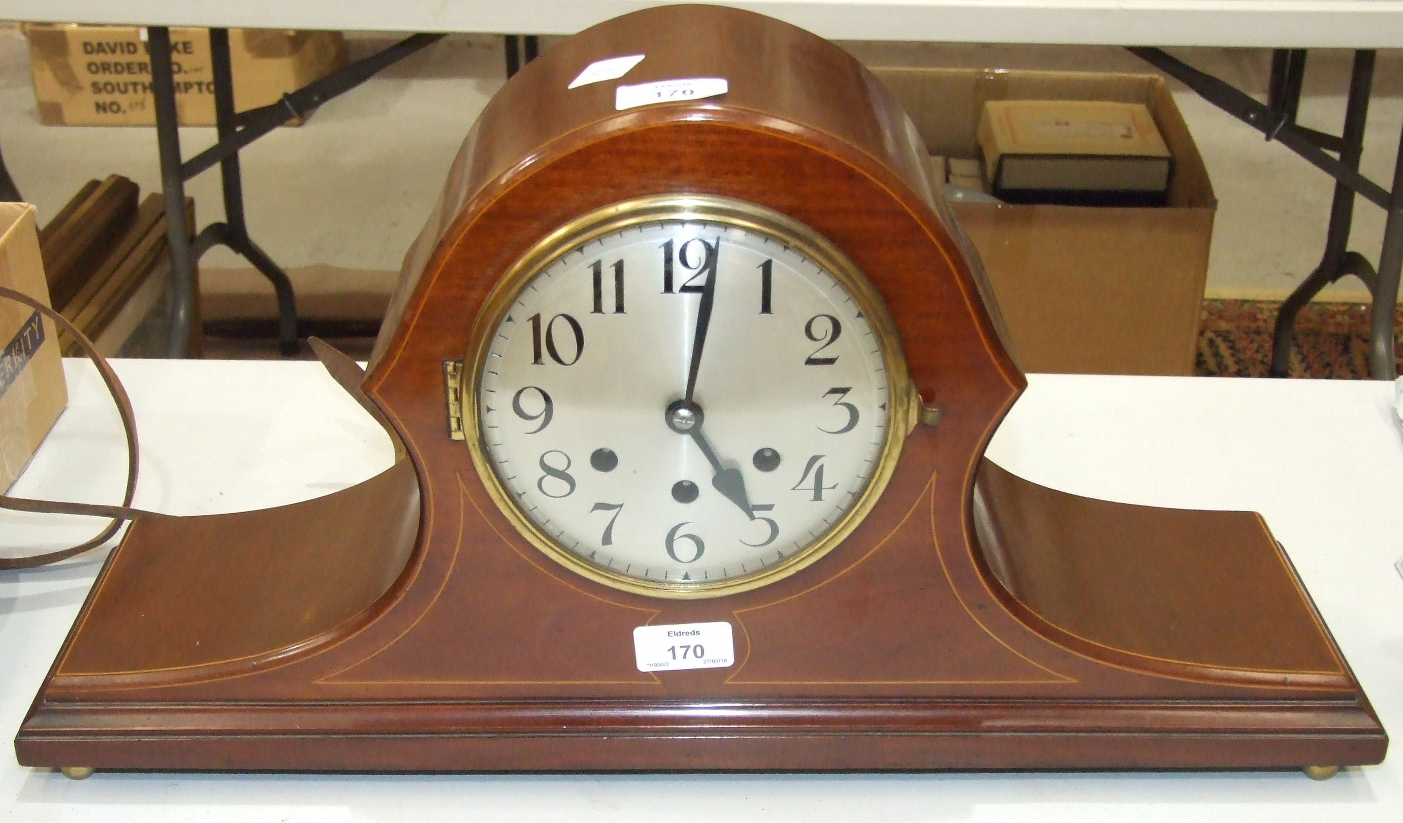 An inlaid mahogany 'Napoleon hat' shape chiming clock by Badische Uhrenfabrik, the movement