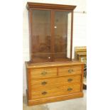 An Edwardian oak chest of two short and two long drawers, 126cm wide, together with a glazed