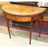 A George III mahogany and satinwood circular fold-over card table on square tapered legs, 92cm