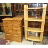 A set of modern light wood four-tier open shelves, 76cm wide, 150cm high and a modern pine chest