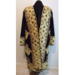 A gentleman's ceremonial dress coat, possibly Moldovan, ornately embroidered with gold thread and