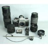 A Praktica MTL 5B camera with four lenses: two Helios 44 2/58, a Sunagor MC Autozoom 80-200mm/f4.5-