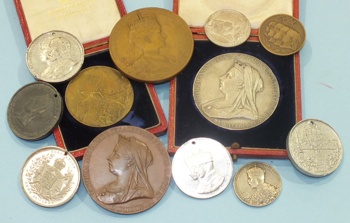 A collection of various medallions, including Queen Victoria 1837-1897 silver, cased and similar