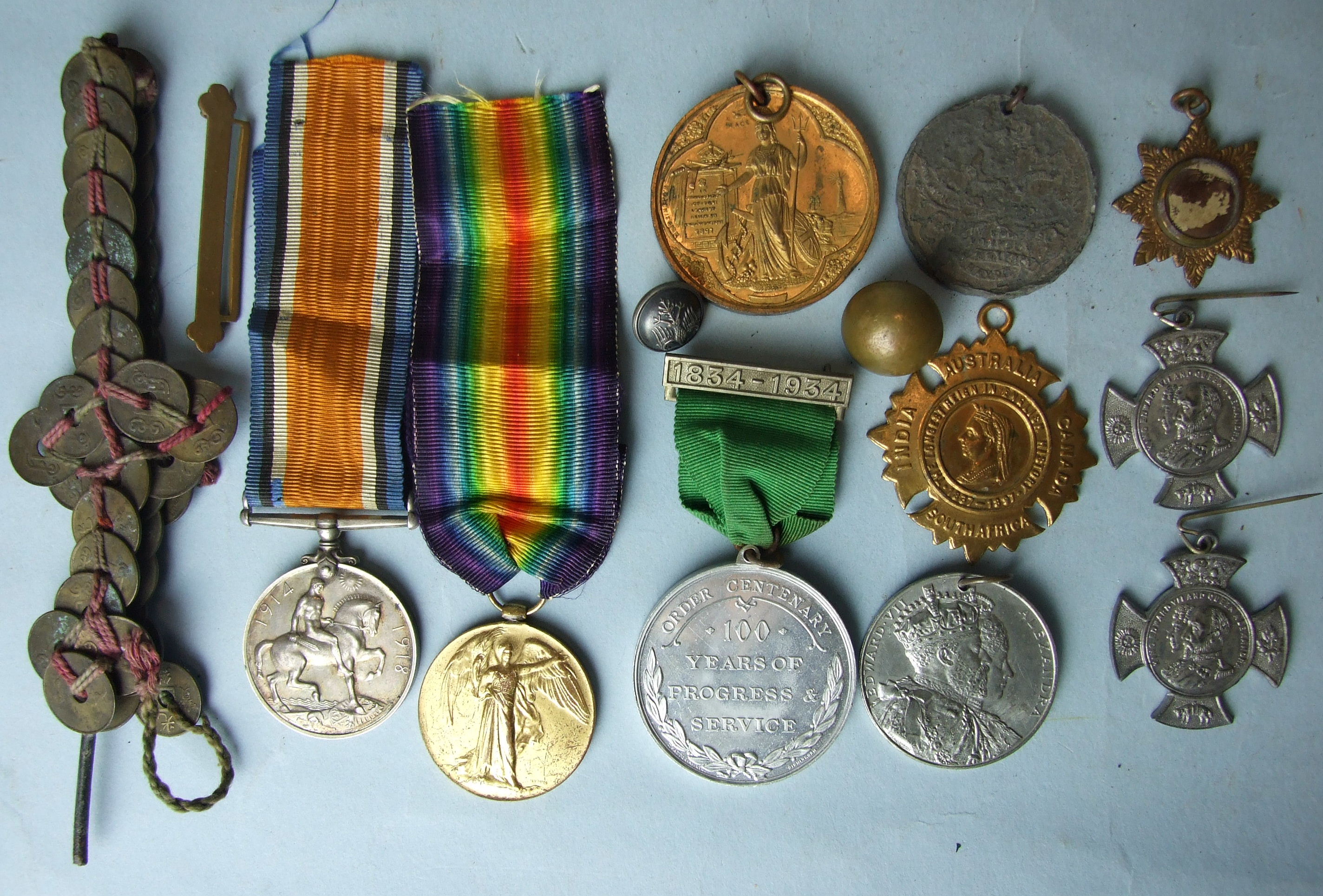 A WWI pair awarded to 30377 Pte C Rolston R Lanc. Rgt, a "cross" made from Chinese coins, together