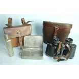 A pair of Karl Zeiss Jena Deltrintem 8 x 30 binoculars in leather case, and a leather hunting case