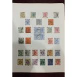 A collection of Hong Kong stamps on leaves, including 1948 wedding set, both mint and on plain first