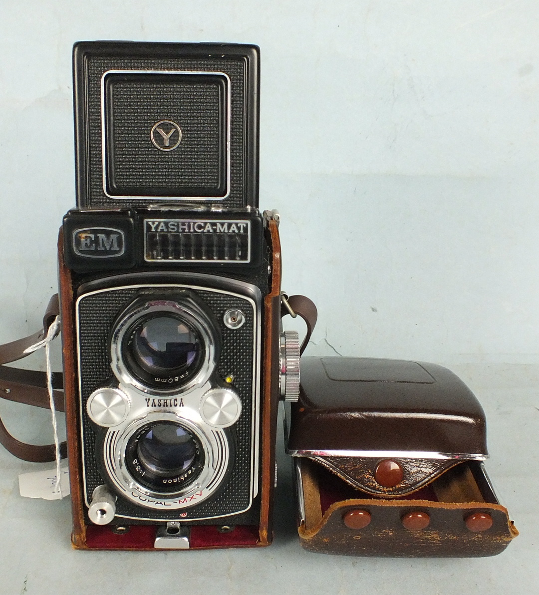 A Yashica-Mat E M twin lens camera with Yashinon 1:3.2 f:80 and 1:3.5 f:80 lenses, in leather case