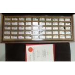 John Pinches, fifty sterling silver ingots, '1000 Years of British Monarchy', in fitted wooden case,
