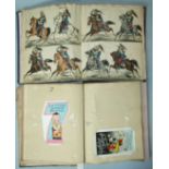 Two Victorian scrap albums containing hand coloured lithographs of European artillery and cavalry,