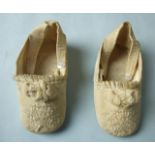 A pair of Victorian baby shoes of ivory gross grain, embroidered with flowers with silk ribbon trim,
