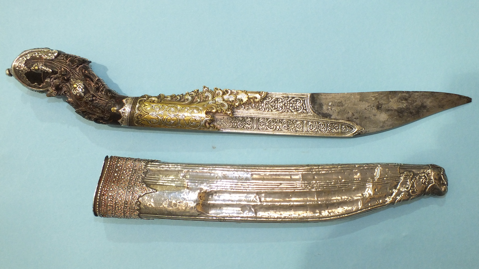 An 18th century Ceylonese Piha-Kaetta dagger, the blade partially-covered with elaborate chasing,