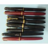 A collection of eight Parker fountain pens: two no.17, two Slimfold, one Victory and three