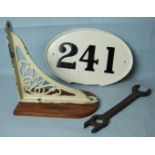 A GWR cast iron wall bracket, a cast iron wagon plate "241", (af), and a GWR water gauge spanner, (