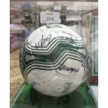 A signed Plymouth Argyle football circa 2012, in Perspex display case.