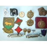 A Phillips of Aldershott shooting medallion, boxed, a silver shooting medal, two RAF cap badges