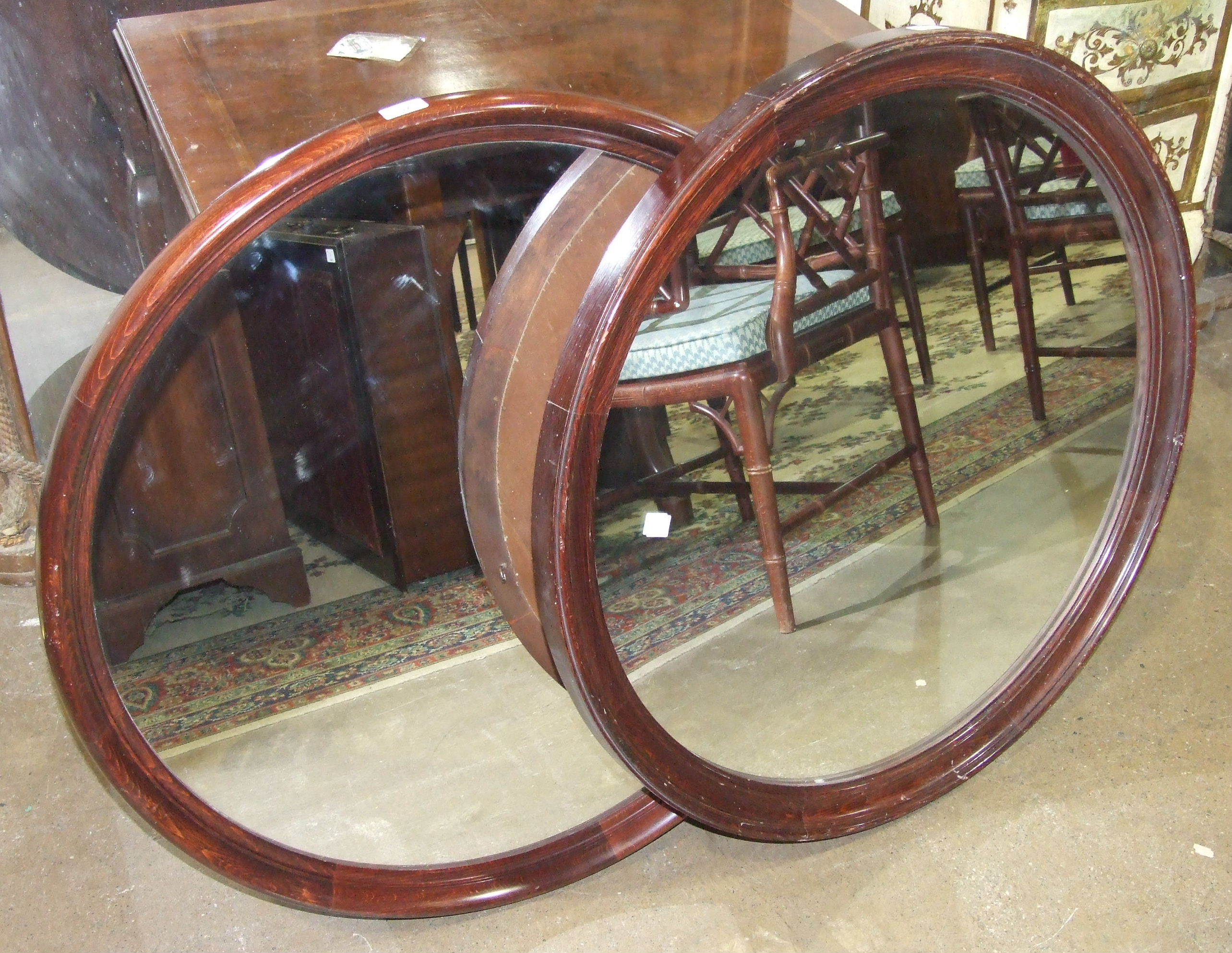 Two stained wood circular framed wall mirrors, (2).