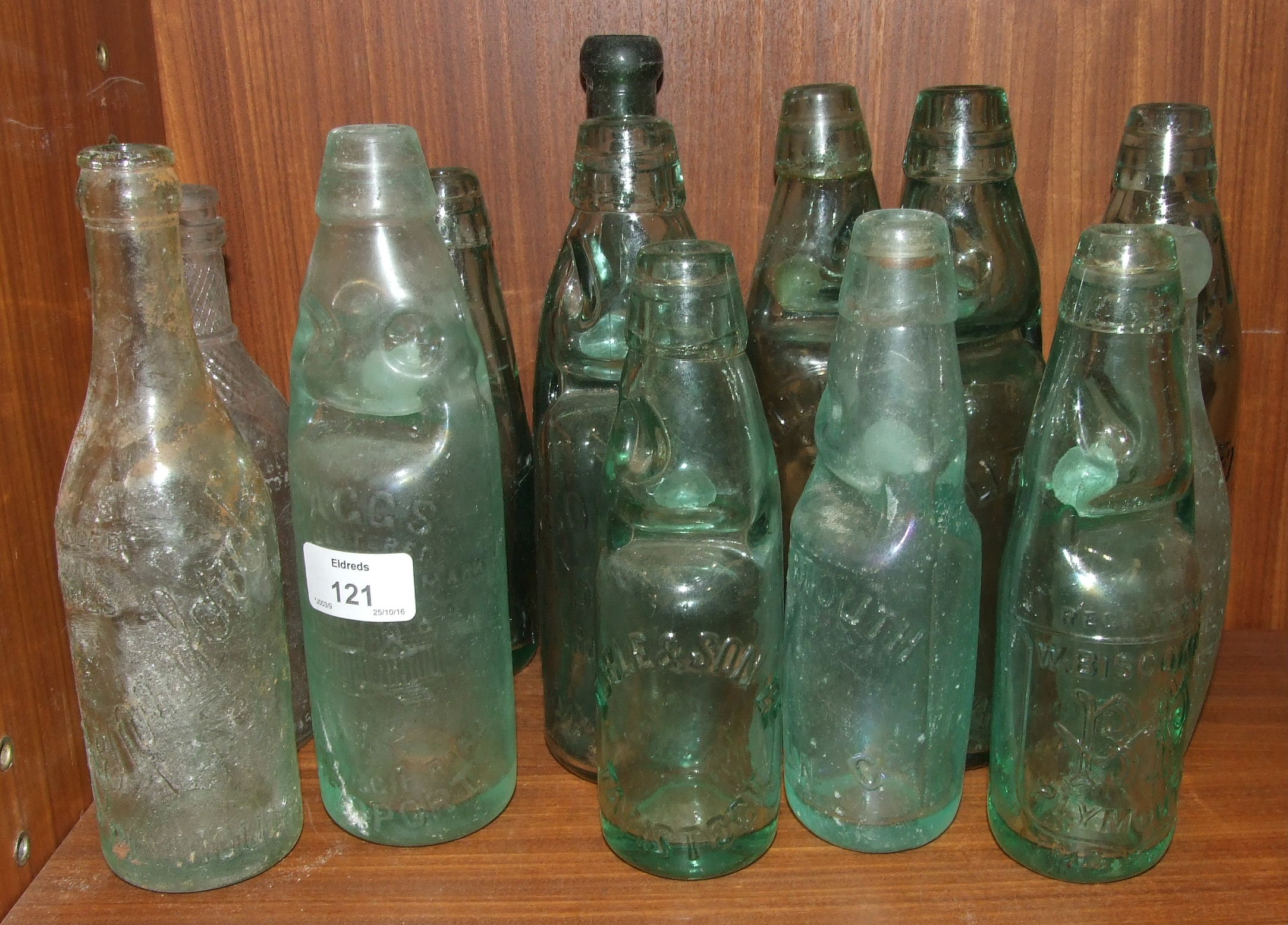 A collection of cod stopper lemonade bottles, including Dartmouth PAW Co, Doble & Son, Tavistock, R.