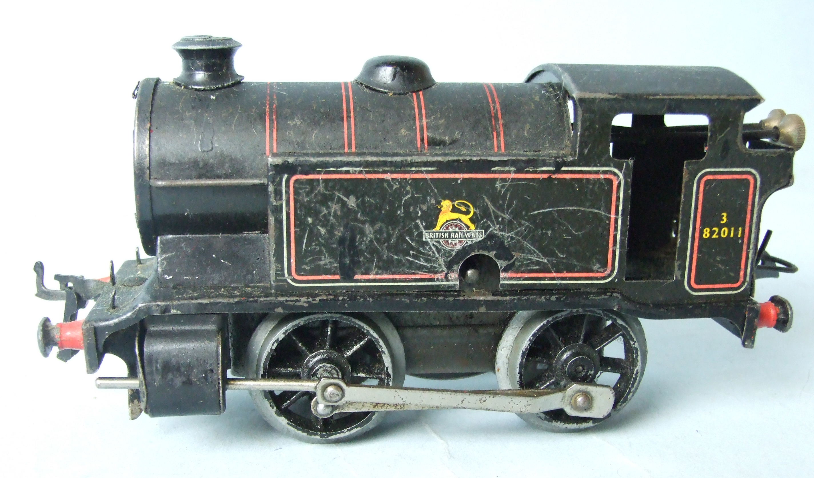 O Gauge, Hornby Type 40 0-2-0 clockwork tank engine, black BR, no.82011 and a scratch-built 5600