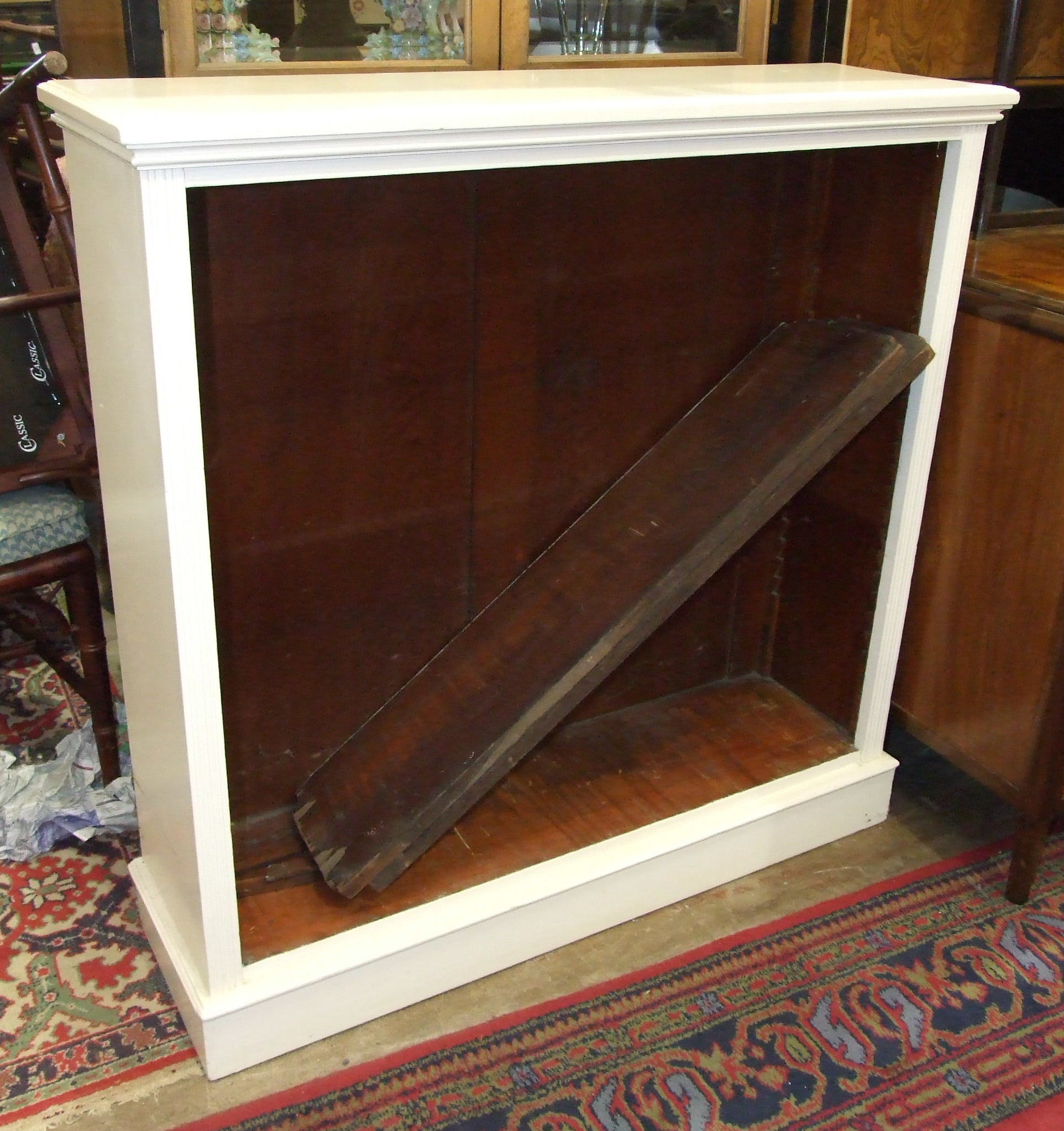 A painted wood open bookshelf with adjustable shelves, 104cm wide, 106cm high.