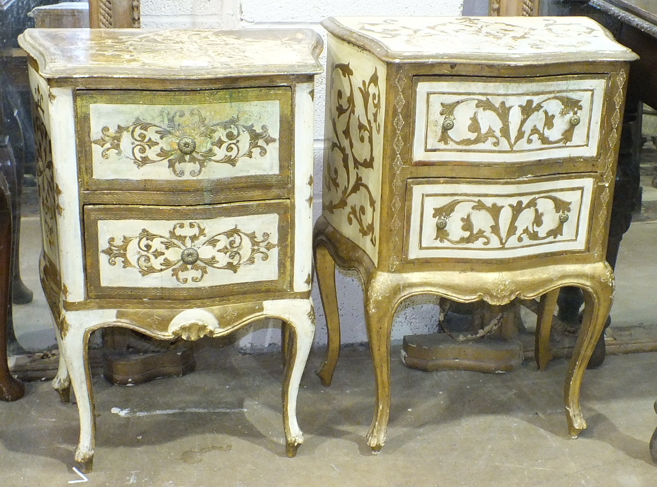 A pair of white and gilt decorated Continental bedside cupboards, 55cm wide, 75cm high, (2).