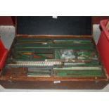 A large quantity of mainly red and green Meccano, contained in a fitted wooden box.