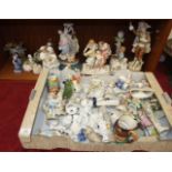 A collection of late-19th and 20th century ceramic and bisque figure ornaments, many damaged.