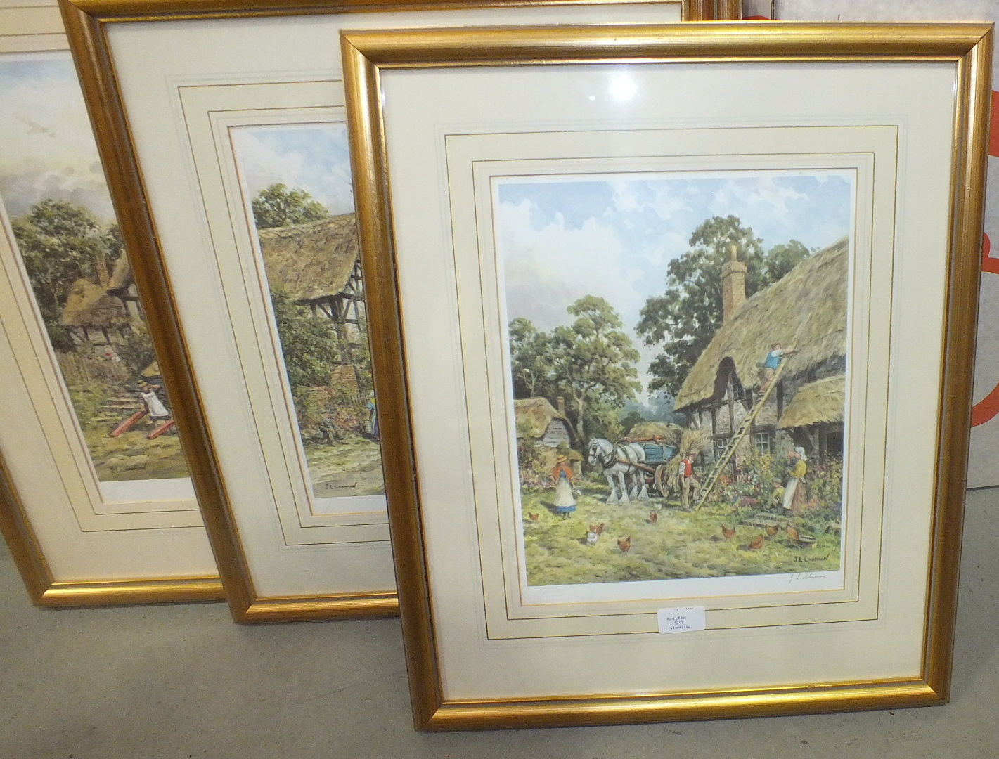 After J L Chapman, 'Figures outside cottage with traction engine approaching', a framed coloured - Image 2 of 3