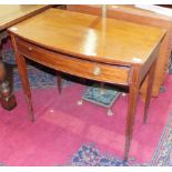 An Edwardian inlaid mahogany side table, the shaped rectangular top above a frieze drawer, on square