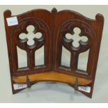 A 19th century walnut prayer book stand of pierced Gothic design, 26 x 24cm.