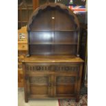 A late-20th century oak dresser, the arch shelved top above two bullet-mould frieze drawers and a