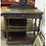 A Victorian carved oak three-tier buffet fitted with frieze drawer, 105cm wide, 107cm high.