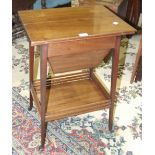 An early-20th century mahogany work table, the rectangular folding top revealing a fitted