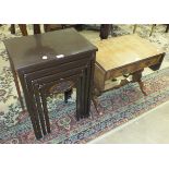 A reproduction walnut small sofa table, two torchère stands and a nest of four tables, (4).