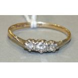 An 18ct gold ring set three brilliant-cut diamonds, size P½, 1.6g.