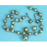 A necklace of silver balls, (a/f) and a pair of similar earrings, (2).